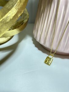 Dior Gold Chain with a Lock Pendant